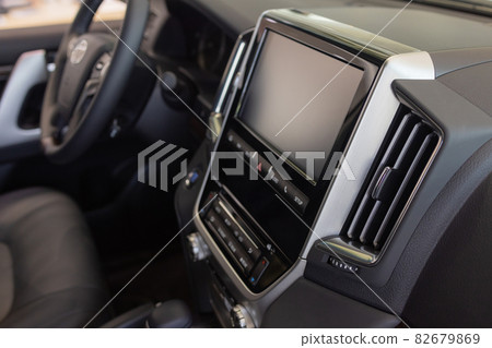 Luxury car interior details. Middle console with gearbox controls. Luxury car interior details. Middle console with gearbox controls. 82679869