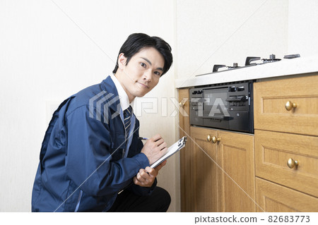 A salesman at a construction shop who makes a quote for remodeling A salesman at a construction shop who makes a quote for remodeling 82683773