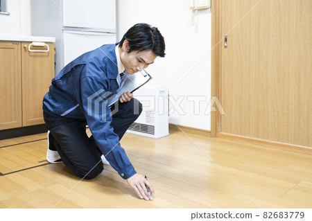 Workers inspecting flooring Workers inspecting flooring 82683779