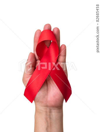 World aids day and national HIV AIDS and ageing awareness month with red ribbon on helping hand (isolated with clipping path on white background) World aids day and national HIV AIDS and ageing awareness month with red ribbon on helping hand (isolated with clipping path on white background) 82685458