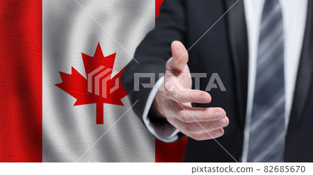 Canadian business, politics, cooperation and travel concept. Hand on flag of Canada background. 82685670
