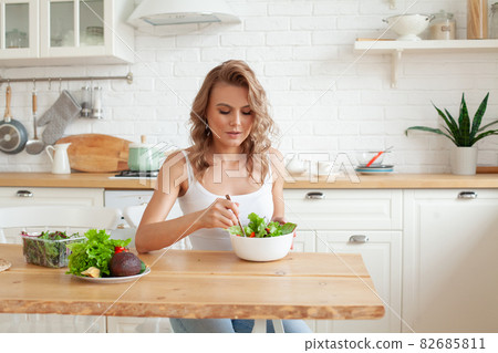 Pretty lady with vegetable salad Pretty lady with vegetable salad 82685811