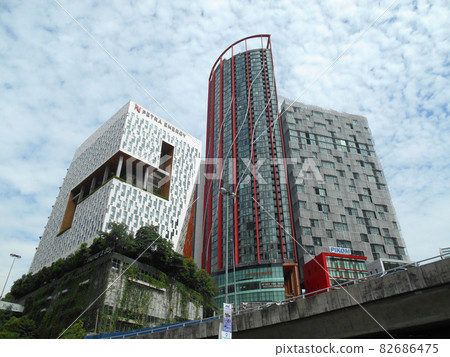 KUALA LUMPUR, MALAYSIA -JUNE 16, 2016: High rise building facade with sun shade devices to protect direct sun light entering the building.  82686475
