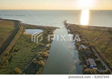 Awesome drone shot of fishing huts in adriatic coast Awesome drone shot of fishing huts in adriatic coast 82687840