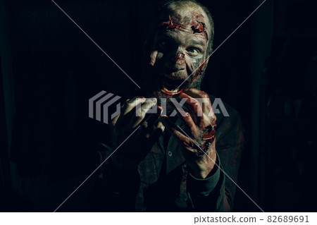Zombie male makeup for halloween concept. Blood on skin face 82689691