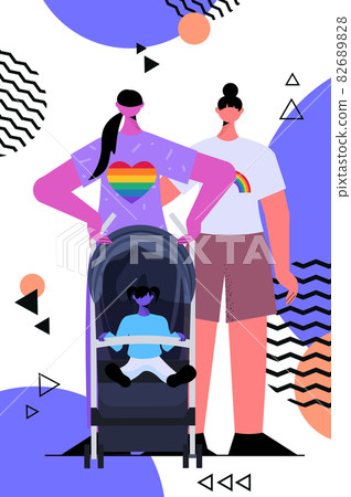 lesbian family walking with newborn baby in stroller motherhood transgender love LGBT community 82689828