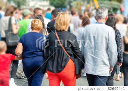Crowd of people on city street 82690441
