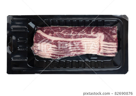 Bacon in the package on a white background. Vacuum packed bacon isolated on white background. 82690876