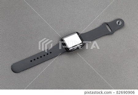 Smart watch with a blank white screen on a gray background. 82690906