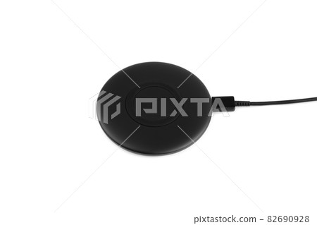Wireless charging for a smartphone on a white background. Fast wireless charger close-up. Wireless charging for a smartphone on a white background. Fast wireless charger close-up. 82690928