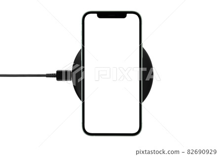 Smartphone with blank screen on wireless charging isolated on white background. Smartphone with blank screen on wireless charging isolated on white background. 82690929