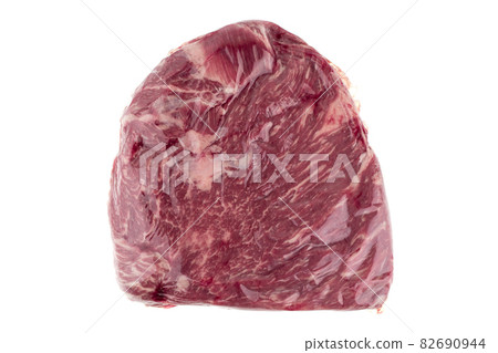 Vacuum packed meat on a white background. Close-up of beef in a vacuum bag. 82690944