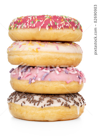 Donuts close-up on a white background. Round donuts isolated on white background. Donuts close-up on a white background. Round donuts isolated on white background. 82690983