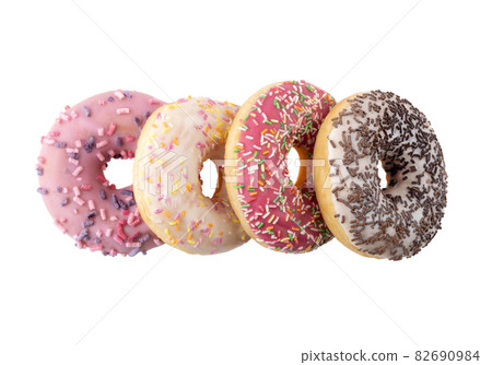 Donuts close-up on a white background. Round donuts isolated on white background. Donuts close-up on a white background. Round donuts isolated on white background. 82690984