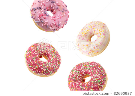 Donut close-up on a white background. Round donut isolated on white background. Donut close-up on a white background. Round donut isolated on white background. 82690987