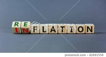 Inflation or reflation symbol. Turned cubes and changed the word inflation to reflation. Beautiful grey background, copy space. Business, inflation or reflation concept. Inflation or reflation symbol. Turned cubes and changed the word inflation to reflation. Beautiful grey background, copy space. Business, inflation or reflation concept. 82691556