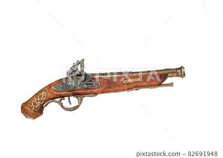 Side view of a mock-up of an antique pistol with bronze inlay. Side view of a mock-up of an antique pistol with bronze inlay. 82691948