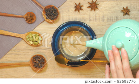 Pour chai into a mug Cut from directly above 82692776