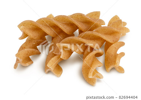 Wolegrain fusilli pasta from durum wheat isolated on white background with clipping path and full depth of field. Wolegrain fusilli pasta from durum wheat isolated on white background with clipping path and full depth of field. 82694404