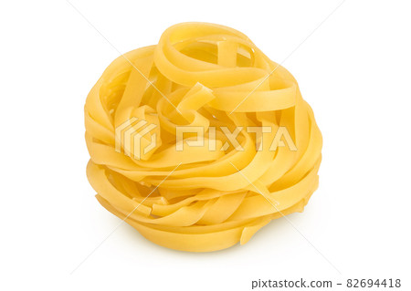 Raw tagliatelle pasta isolated on white background with clipping path and full depth of field 82694418