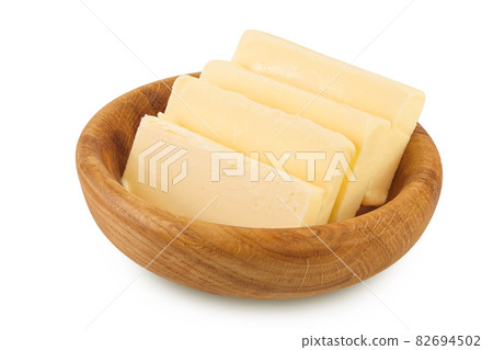 butter slices in wooden bowl isolated on white background with clipping path and full depth of field butter slices in wooden bowl isolated on white background with clipping path and full depth of field 82694502