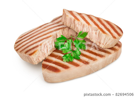 Tuna fish steak grilled isolated on white background with clipping path and full depth of field Tuna fish steak grilled isolated on white background with clipping path and full depth of field 82694506