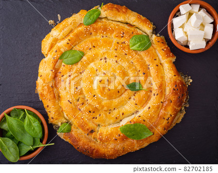 Baked spanakopita with feta and spinach Baked spanakopita with feta and spinach 82702185