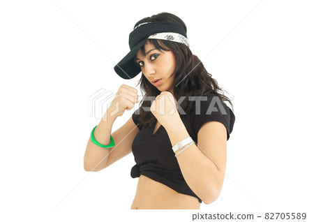 Young woman in boxing guard position and confident attitude 82705589