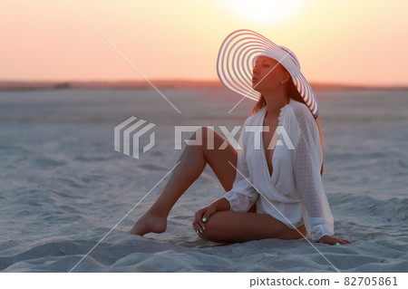 Sensual model in beachwear on sandy shore Sensual model in beachwear on sandy shore 82705861