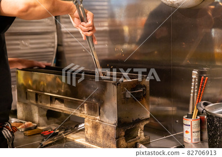 Preparation scene at an izakaya Yakitori restaurant kitchen Preparation scene at an izakaya Yakitori restaurant kitchen 82706913