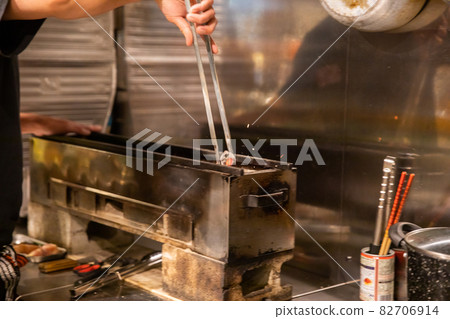 Preparation scene at an izakaya Yakitori restaurant kitchen Preparation scene at an izakaya Yakitori restaurant kitchen 82706914