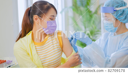 woman has inject vaccine woman has inject vaccine 82709178