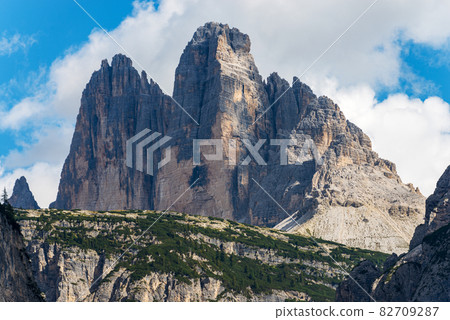 Rock north face of Tre Cime di Lavaredo or Drei Zinnen - Dolomites Italian Alps 82709287