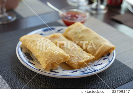 Traditional spring rolls on white plate Traditional spring rolls on white plate 82709347