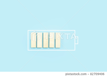 Load battery charge icon background. Wooden blocks as a charging process 82709406