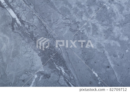 Black marble background. Background with texture and pattern of stone and natural rock of dark, gray color, marble or granite. Black marble background. Background with texture and pattern of stone and natural rock of dark, gray color, marble or granite. 82709712