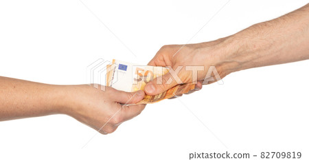 Male and female hand giving and receiving euro's Male and female hand giving and receiving euro's 82709819