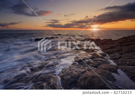 Rathmoylan Cove, Waterford, Ireland. Stunning rocks and sunset. Rathmoylan Cove, Waterford, Ireland. Stunning rocks and sunset. 82710233