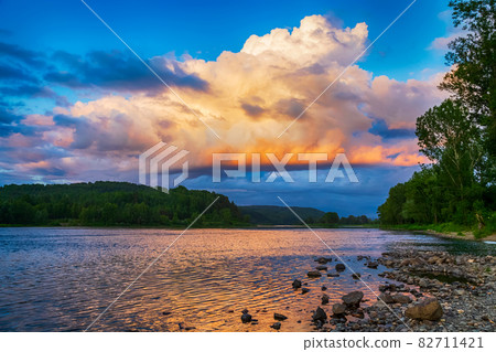 Summer river landscape with sunset cloudy sky 82711421