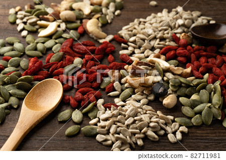 A mix of edible seeds and fruits A mix of edible seeds and fruits 82711981