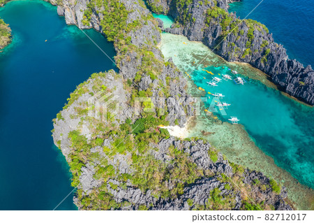 Aerial drone view azure sea and of tourist boats around the beautiful big and small lagoons in El Aerial drone view azure sea and of tourist boats around the beautiful big and small lagoons in El 82712017
