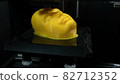 Modern technologies, 3d printer prints the yellow model of the head, the process of printing the face model on the 3d printer. 82712352