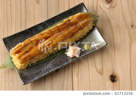 A bird's-eye view of sushi, gari and wasabi placed on bamboo leaves A bird's-eye view of sushi, gari and wasabi placed on bamboo leaves 82713256
