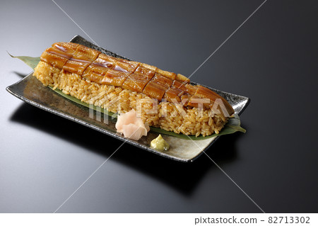 Conger eel placed on bamboo leaves Photographed sushi, gari and wasabi on a black background 82713302