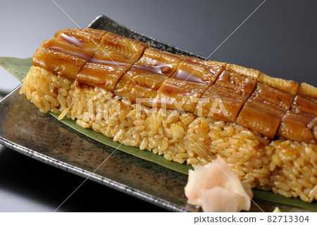 Conger eel placed on bamboo leaves Photographed sushi, gari and wasabi on a black background Conger eel placed on bamboo leaves Photographed sushi, gari and wasabi on a black background 82713304