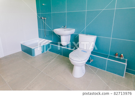 View of a new toilet and bathroom interior for hospital, white and clean 82713976