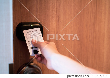 Hand Holding Key card Hotel for access the room Hand Holding Key card Hotel for access the room 82715983
