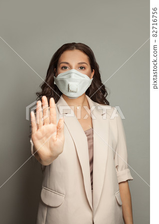 Confident business woman showing stop gesture portrait 82716756
