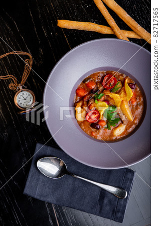 restaurant dishes. Beautiful and tasty meat stew on a plate. beautiful serving food restaurant dishes. Beautiful and tasty meat stew on a plate. beautiful serving food 82717565