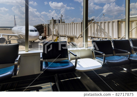 View of departure area waiting chairs airplanes from United Airlines the George Bush Intercontinental Airport IAH in Houston, Texas, United States. 82717875